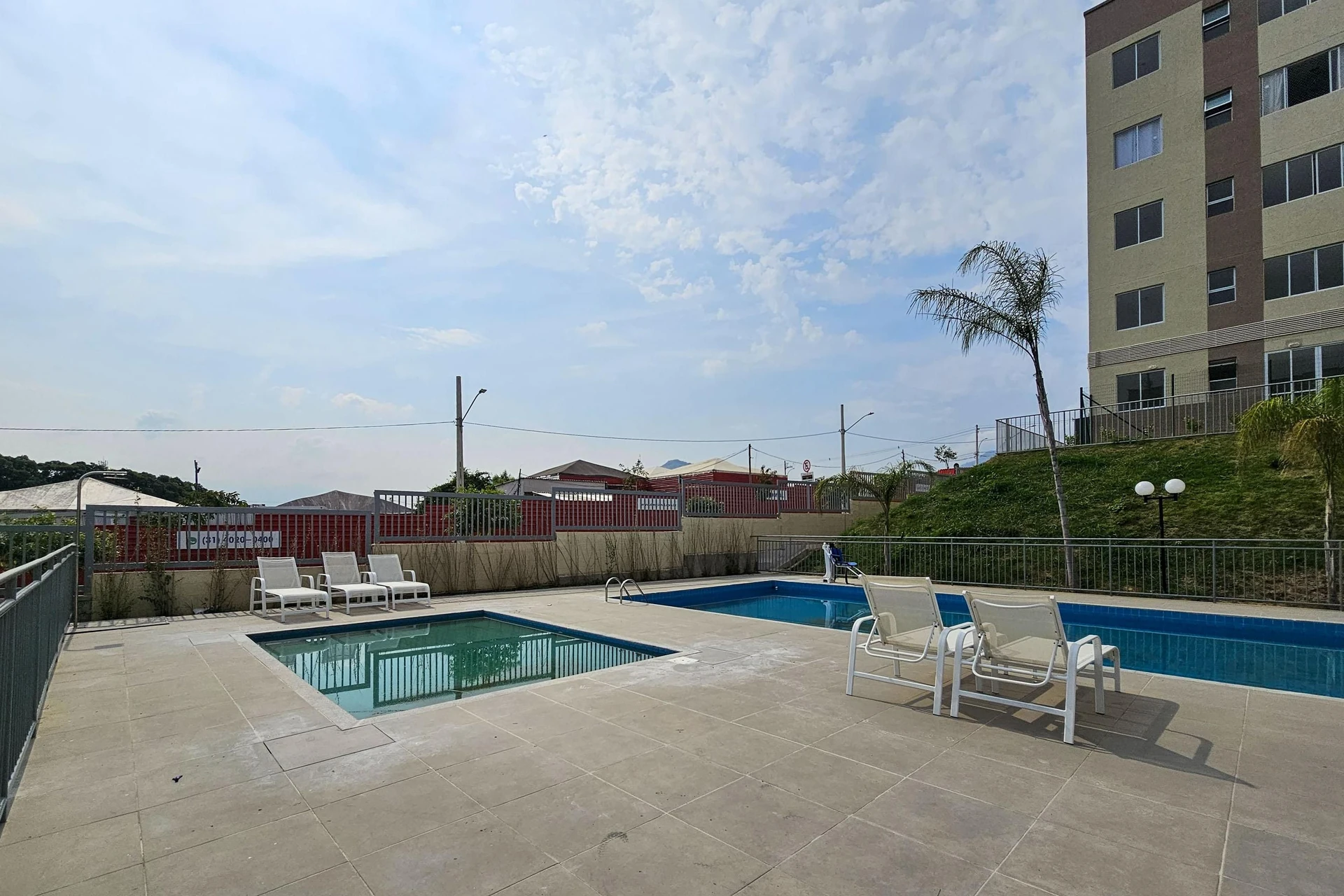2-bedroom apartment in a building with a pool — photo 37