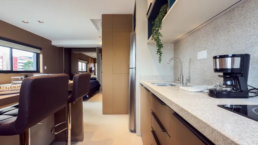 Furnished studio with open-plan kitchen and balcony — photo 11