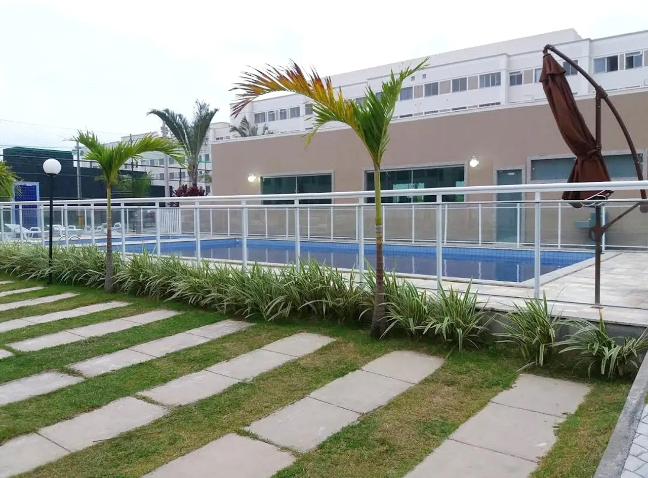 2-bedroom apartment in a building with a pool — photo 9