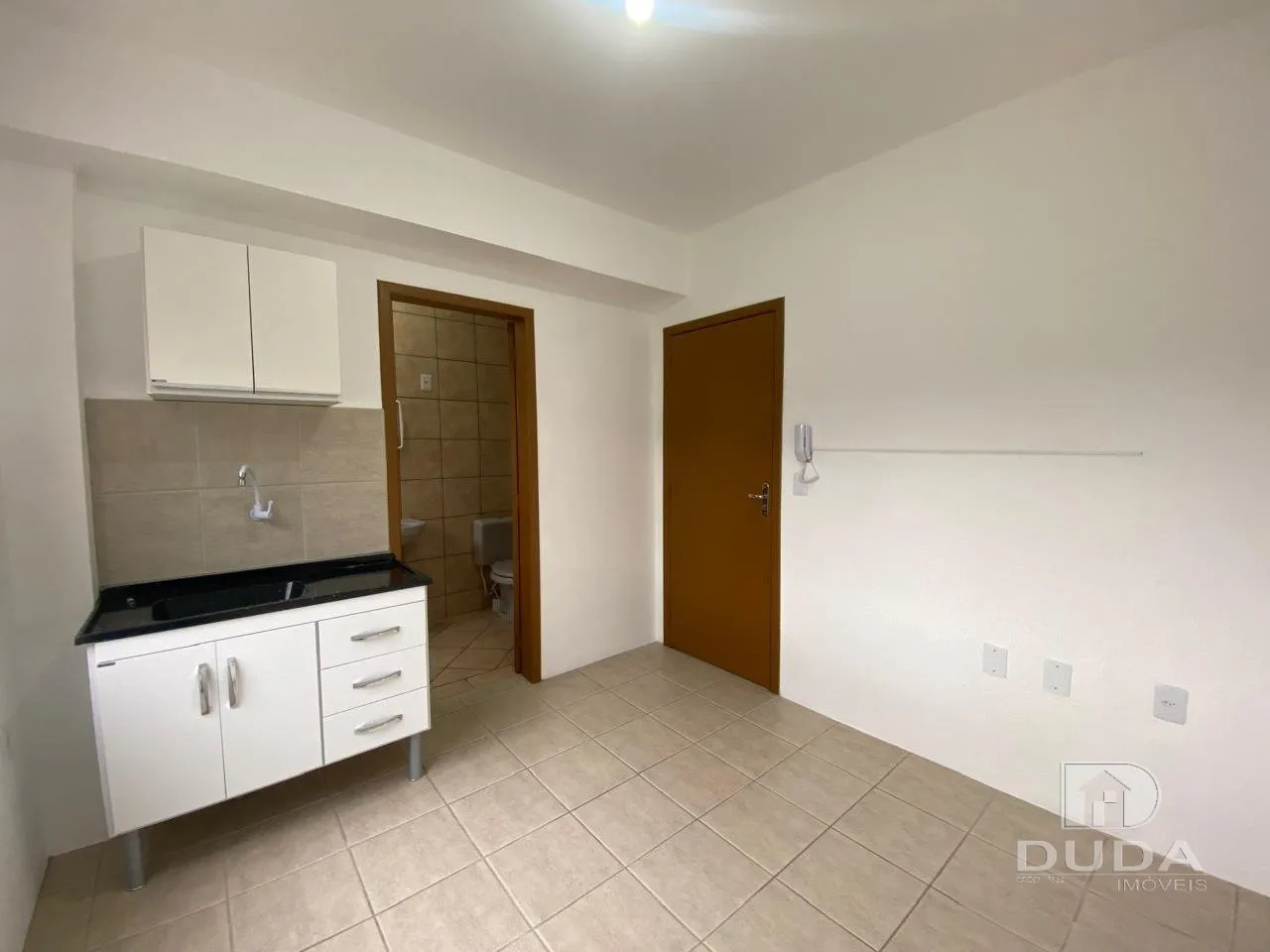 Studio apartment with built-in kitchen cabinets