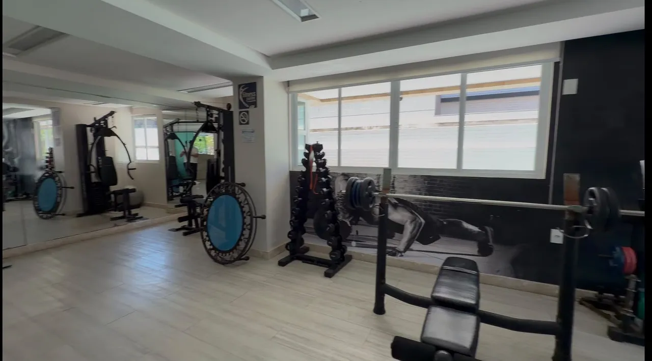 2-bedroom apartment in a building with a pool — photo 14