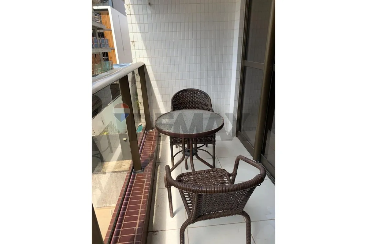 2-bedroom apartment in a building with a pool
