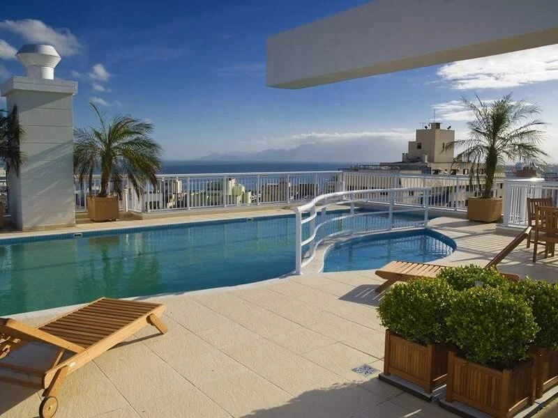 2-bedroom apartment in a building with a pool — photo 13