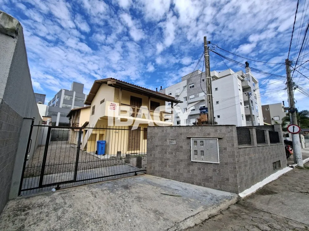 House with 2 bedrooms and a kitchen with stove and hood