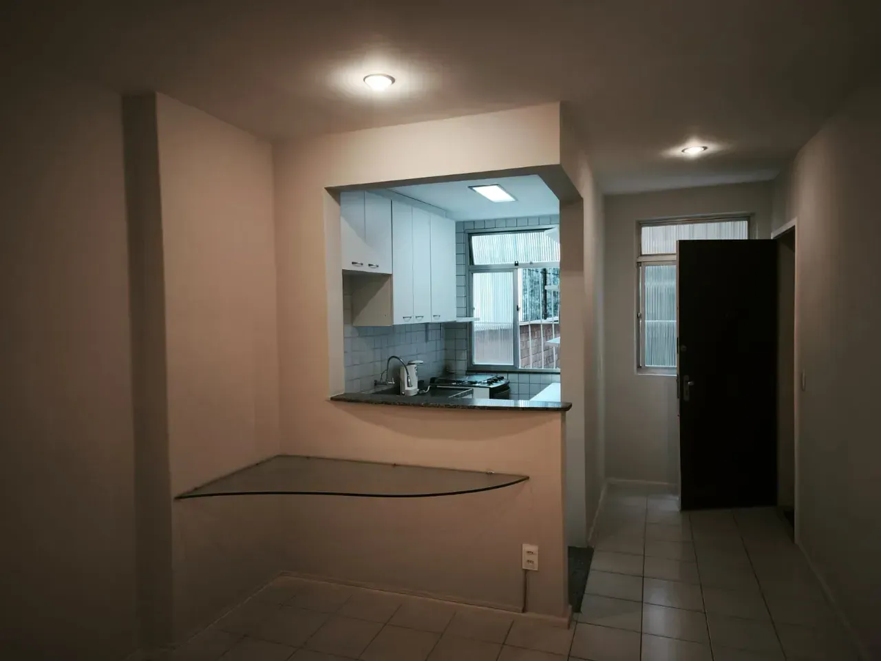 1-bedroom apartment with a closed kitchen and laundry area