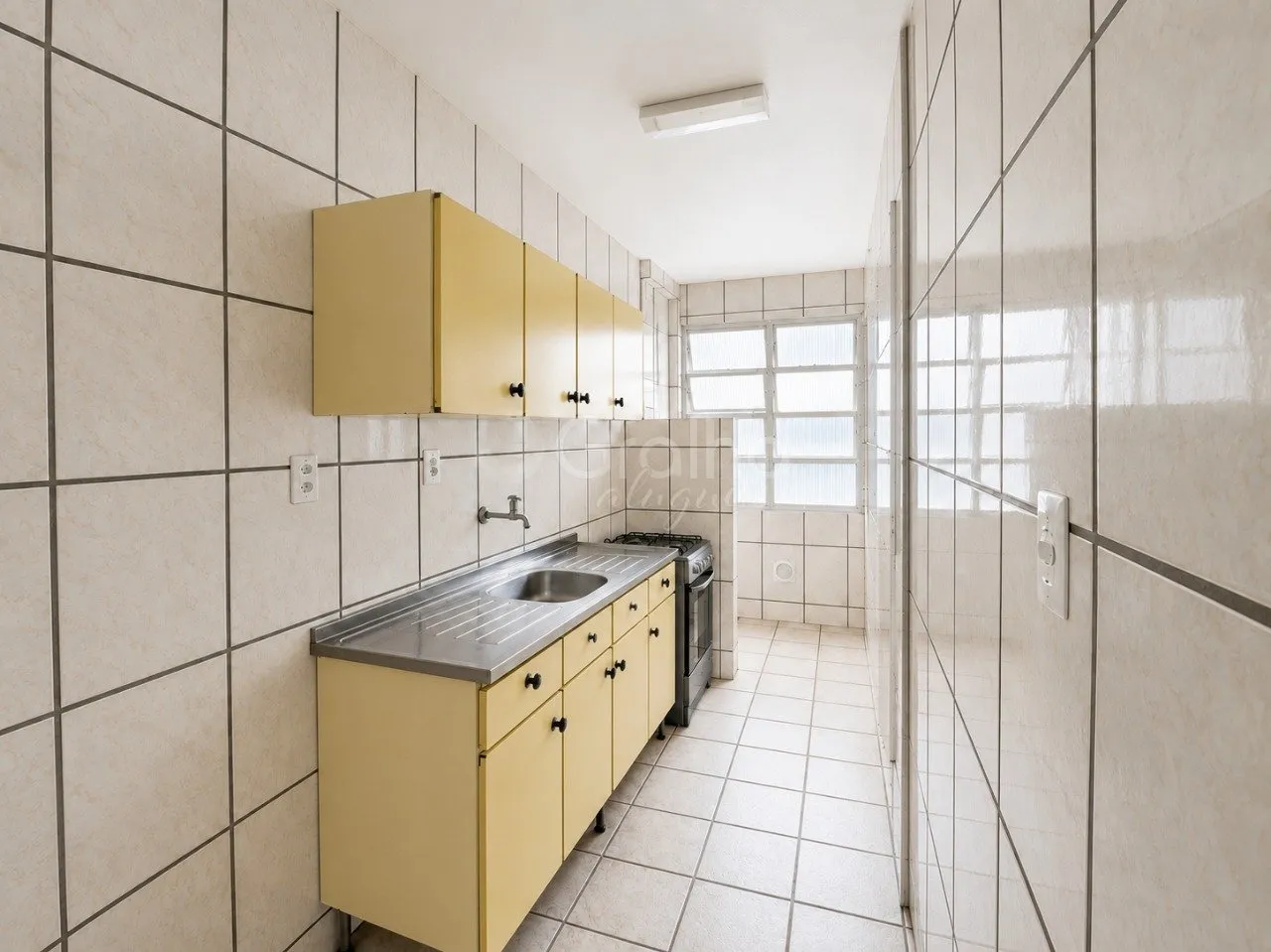 Apartamento de 67 m² com 3 quartos e cozinha fechada