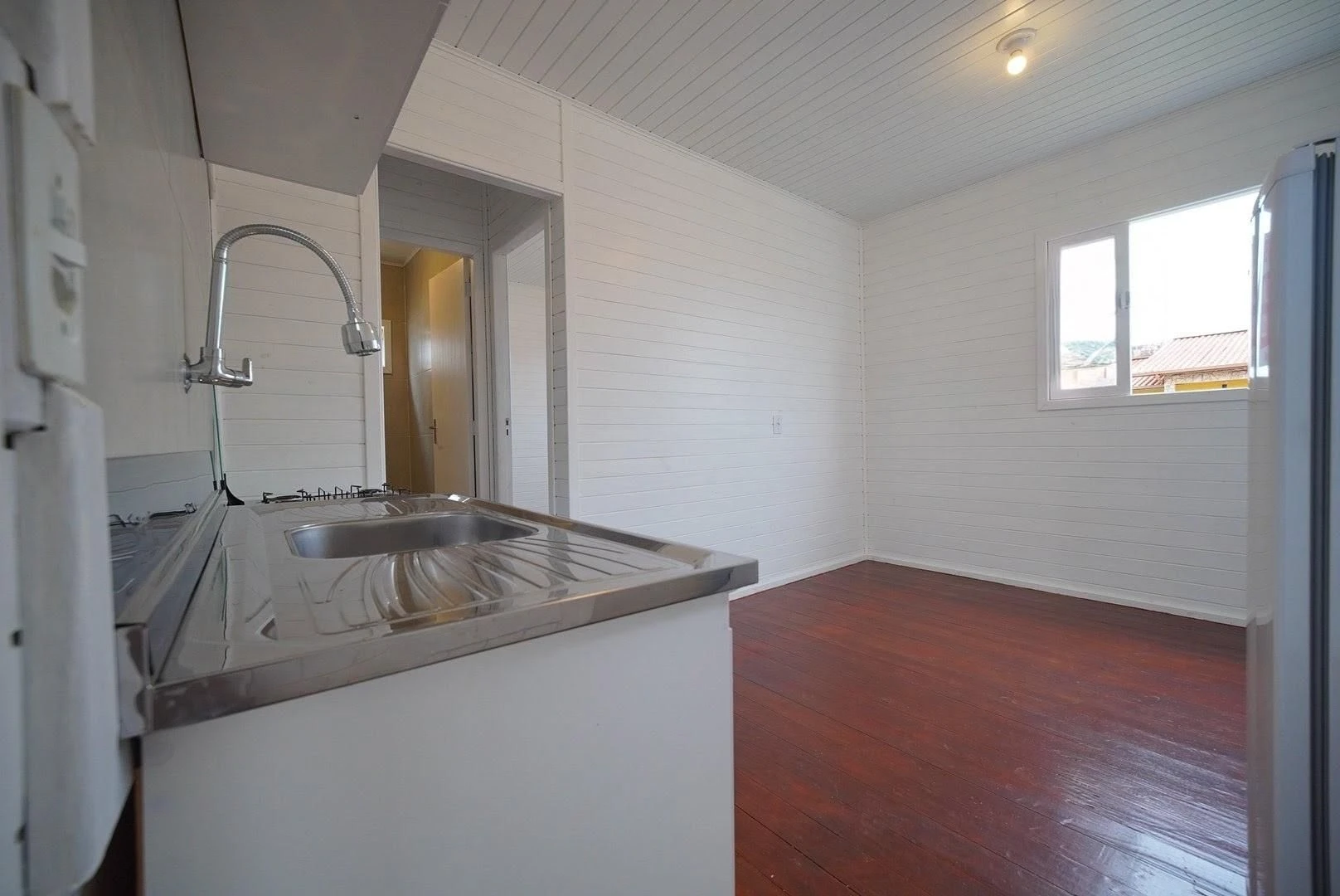 Wood or laminate floors in a one-bedroom house, 24 m²