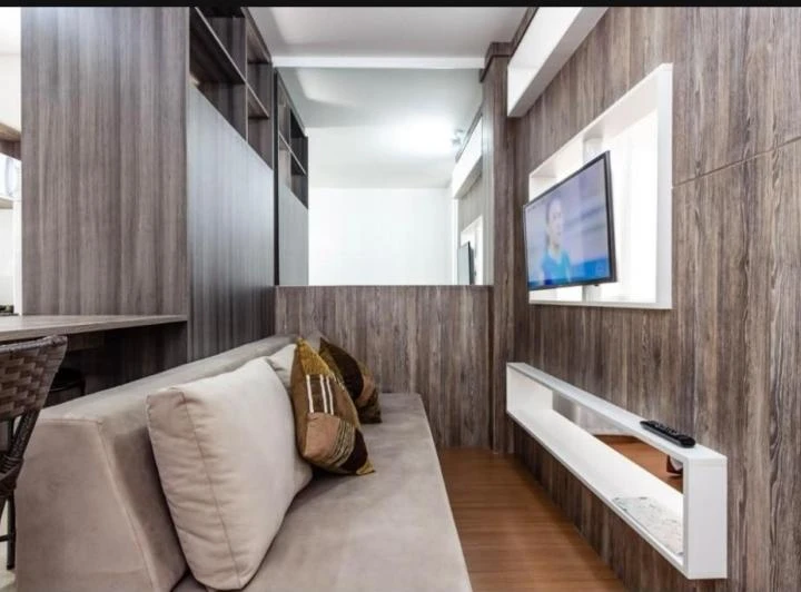 Furnished studio apartment with an open-plan kitchen