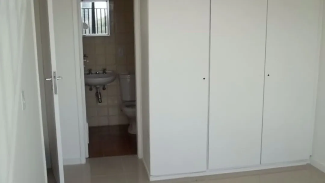 2-bedroom apartment in a building with a pool — photo 16