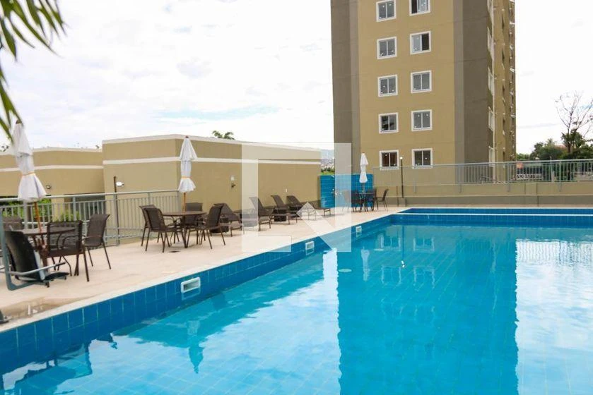 2-bedroom apartment in a building with a pool — photo 14