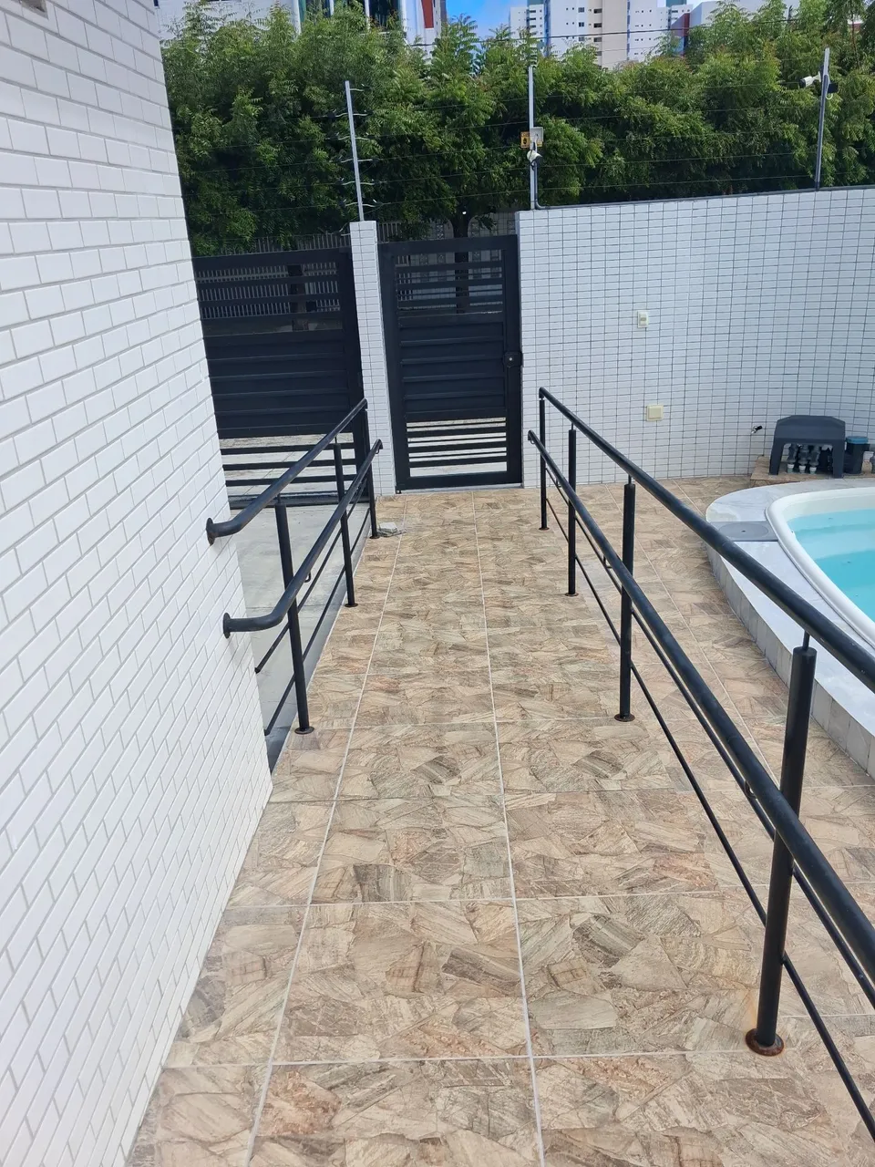 2-bedroom apartment in a building with a pool — photo 19