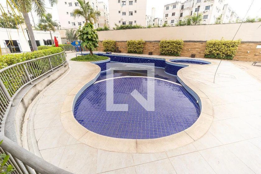 2-bedroom apartment in a building with a pool — photo 17