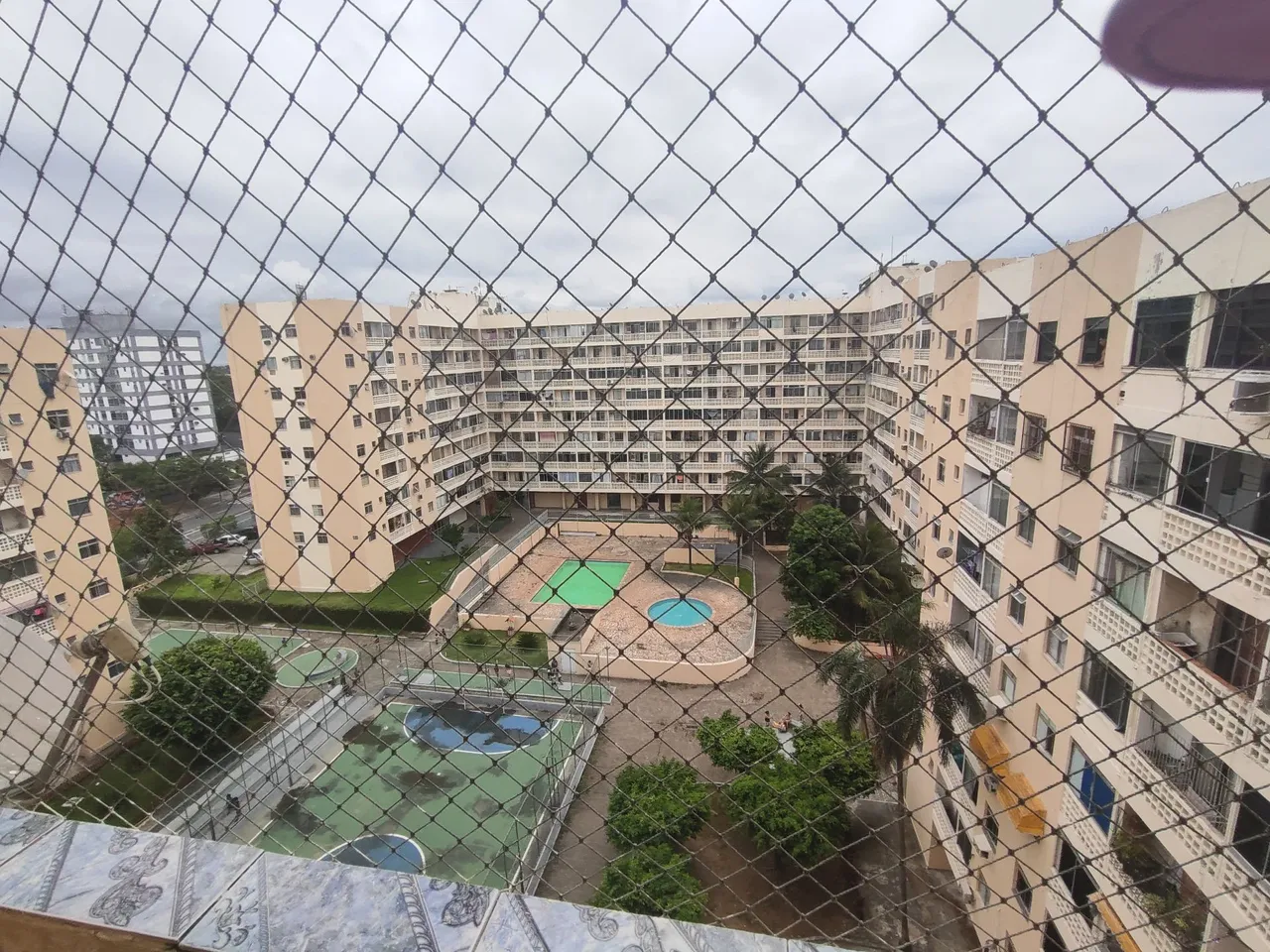 2-bedroom apartment in a building with a pool — photo 13