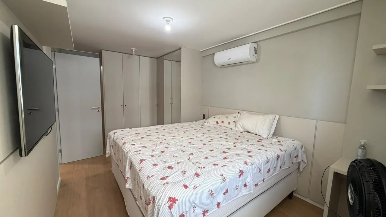 2-bedroom apartment in a building with a pool — photo 13