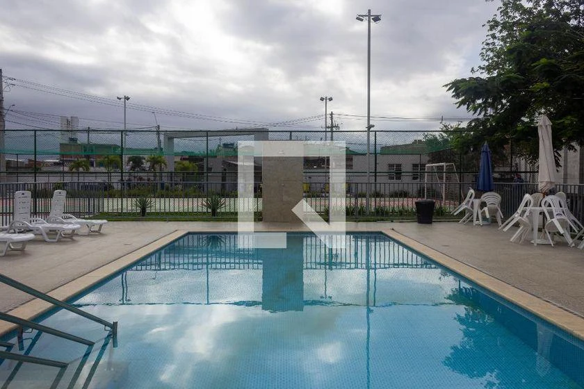 2-bedroom apartment in a building with a pool — photo 36