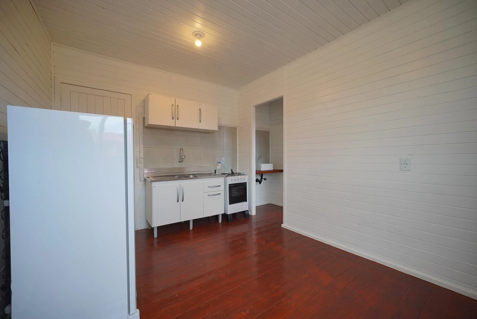 Wood or laminate floors in a one-bedroom house, 24 m² — photo 11