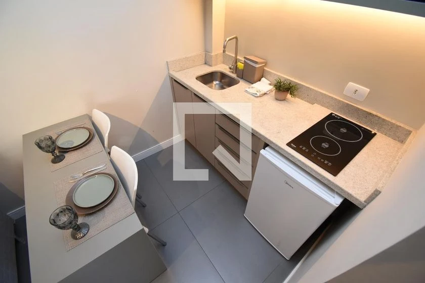 Furnished studio with a balcony and compact kitchenette — photo 5