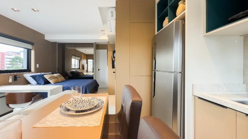 Furnished studio with open-plan kitchen and balcony — photo 10