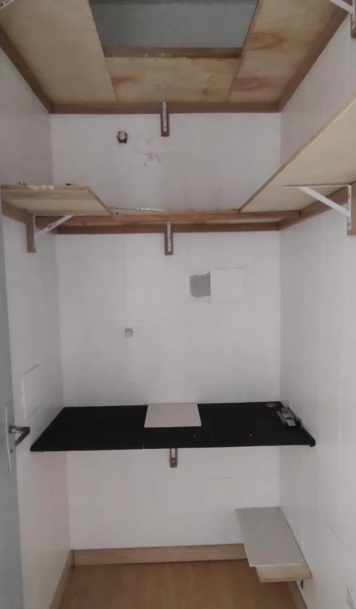 1-bedroom apartment with a closed kitchen and cabinetry — photo 7