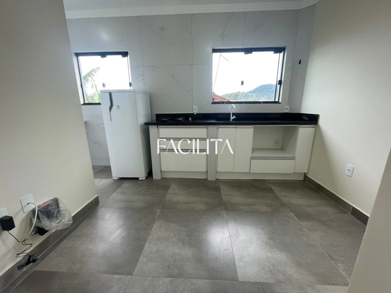 1-bedroom apartment with balcony and laundry area