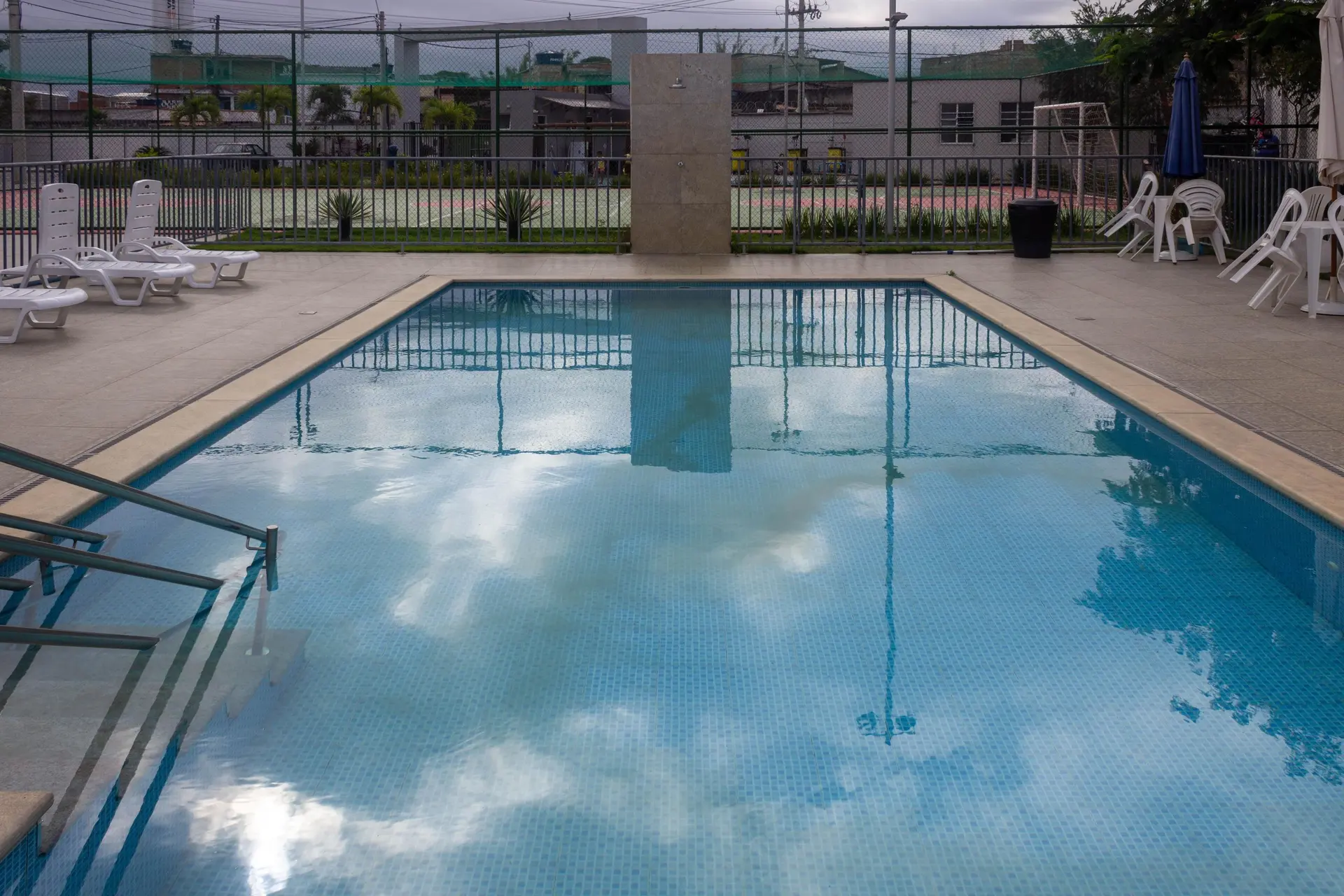 2-bedroom apartment in a building with a pool — photo 14