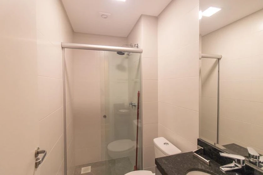Furnished studio kitnet with an open-plan kitchen — photo 12