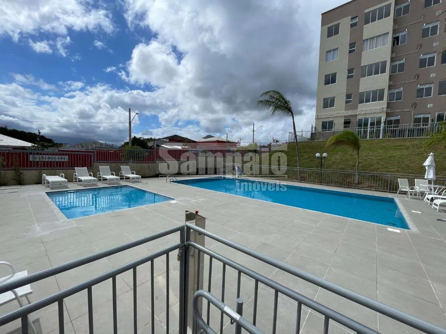 2-bedroom apartment in a building with a pool — photo 8