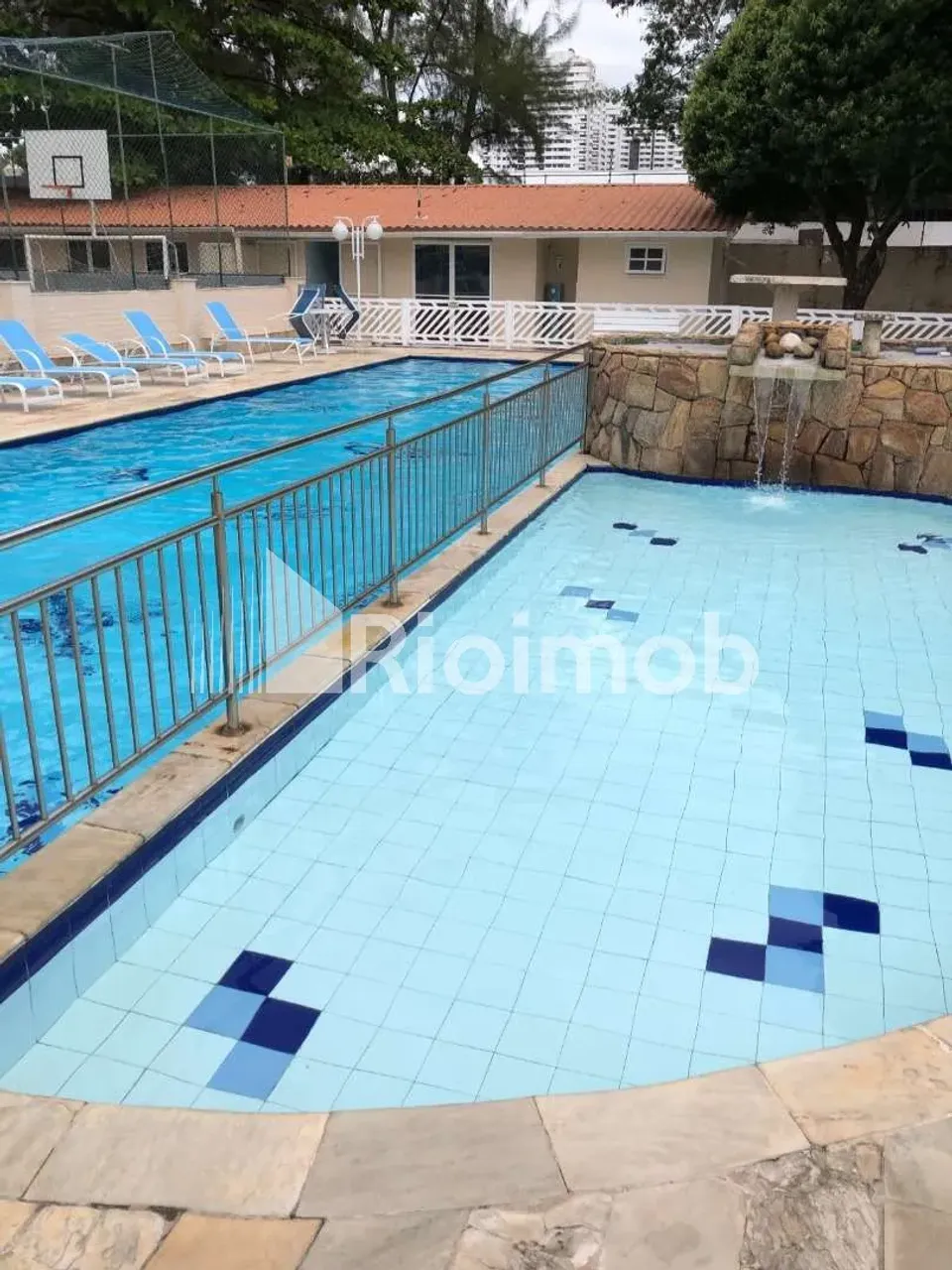 2-bedroom apartment in a building with a pool — photo 5