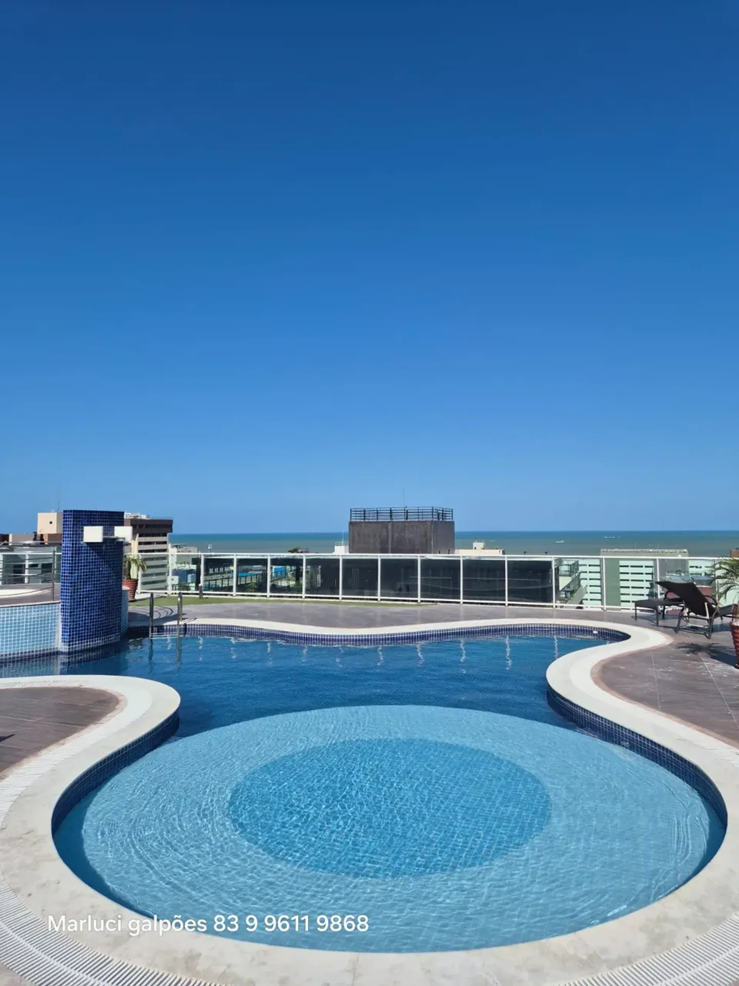 2-bedroom apartment in a building with a pool — photo 5