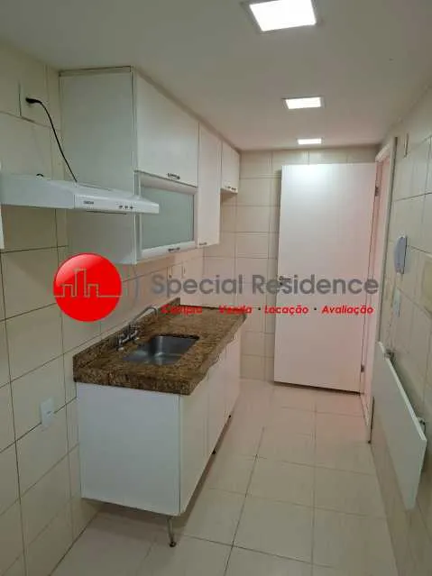 2-bedroom apartment in a building with a pool — photo 2