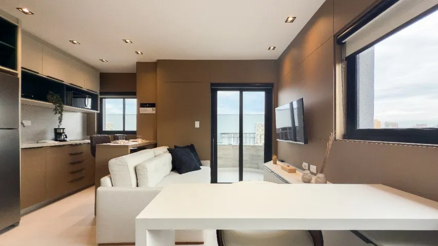 Furnished studio with open-plan kitchen and balcony — photo 18