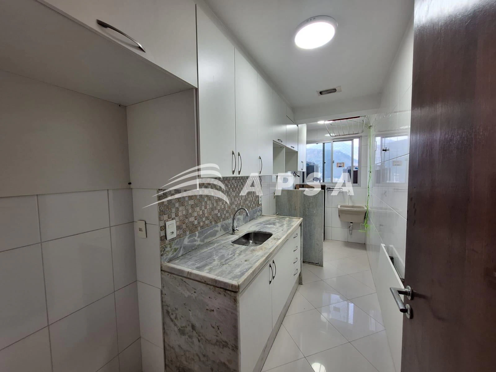 One-bedroom apartment in a building with a pool — photo 11