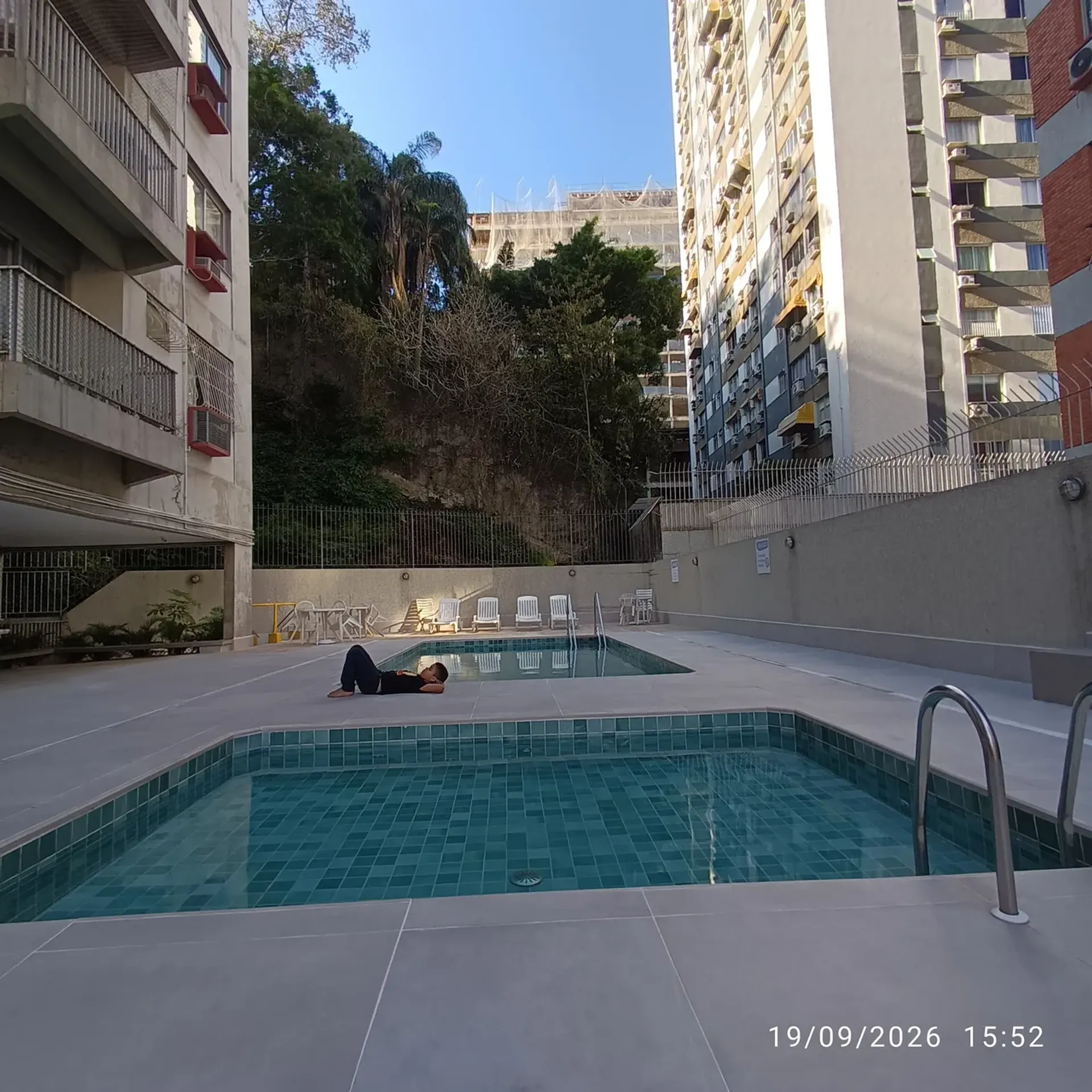 2-bedroom apartment in a building with a pool — photo 9