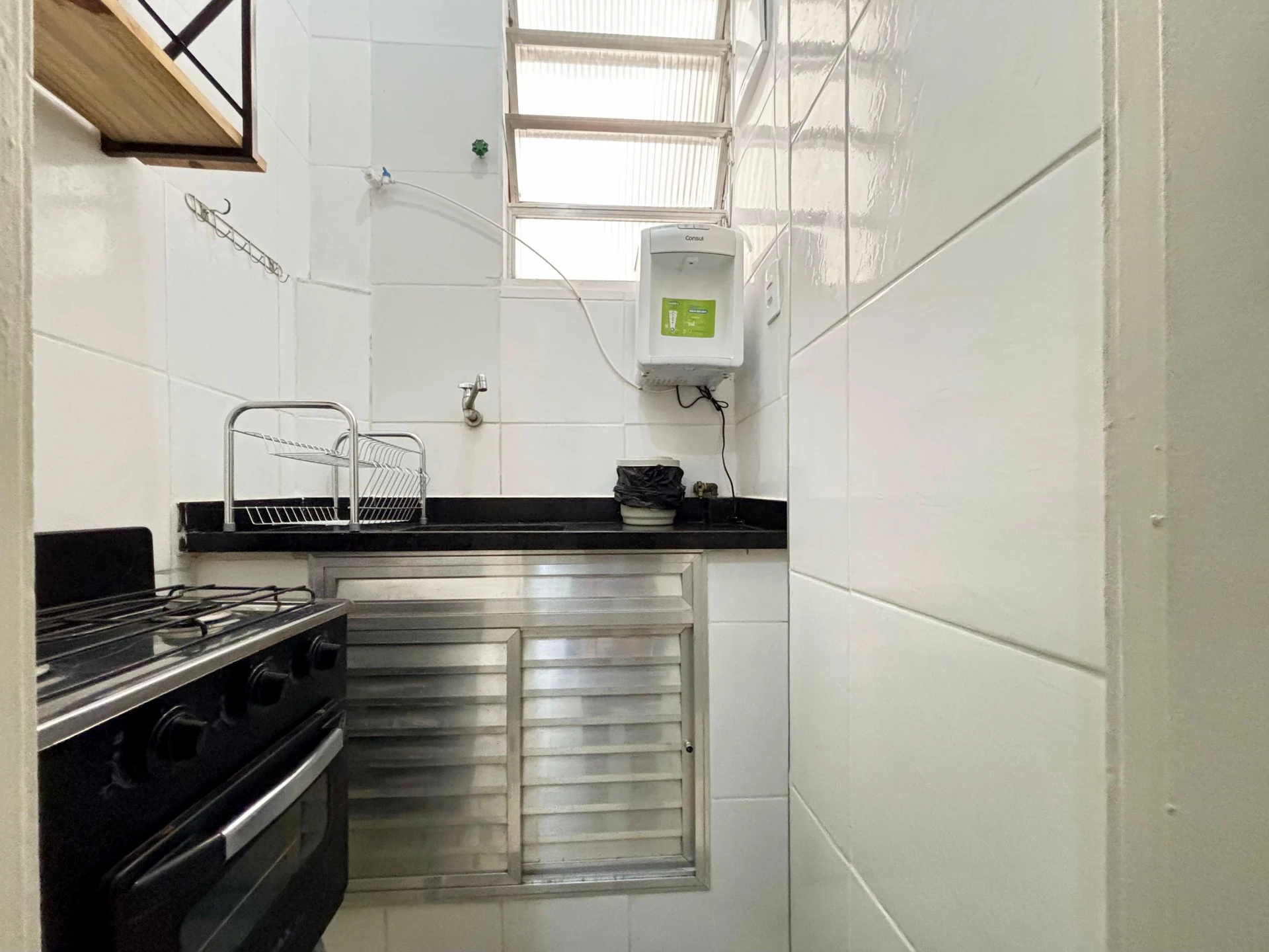 Furnished studio with 1 bedroom and a glass shower — photo 5