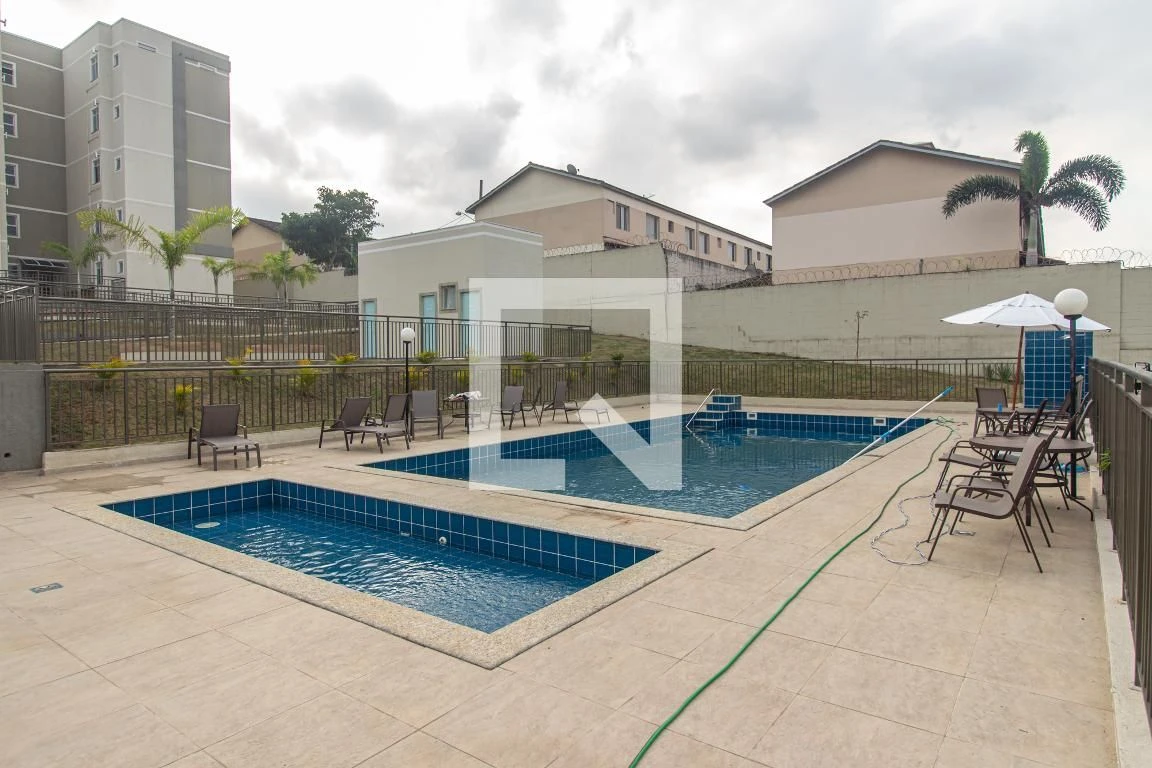 2-bedroom apartment in a building with a pool — photo 16