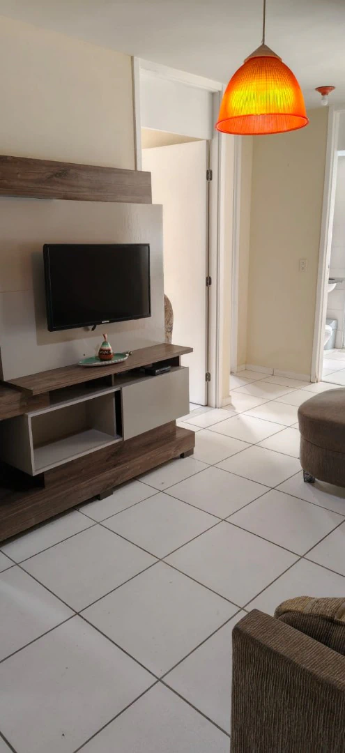 2-bedroom apartment in a building with a pool