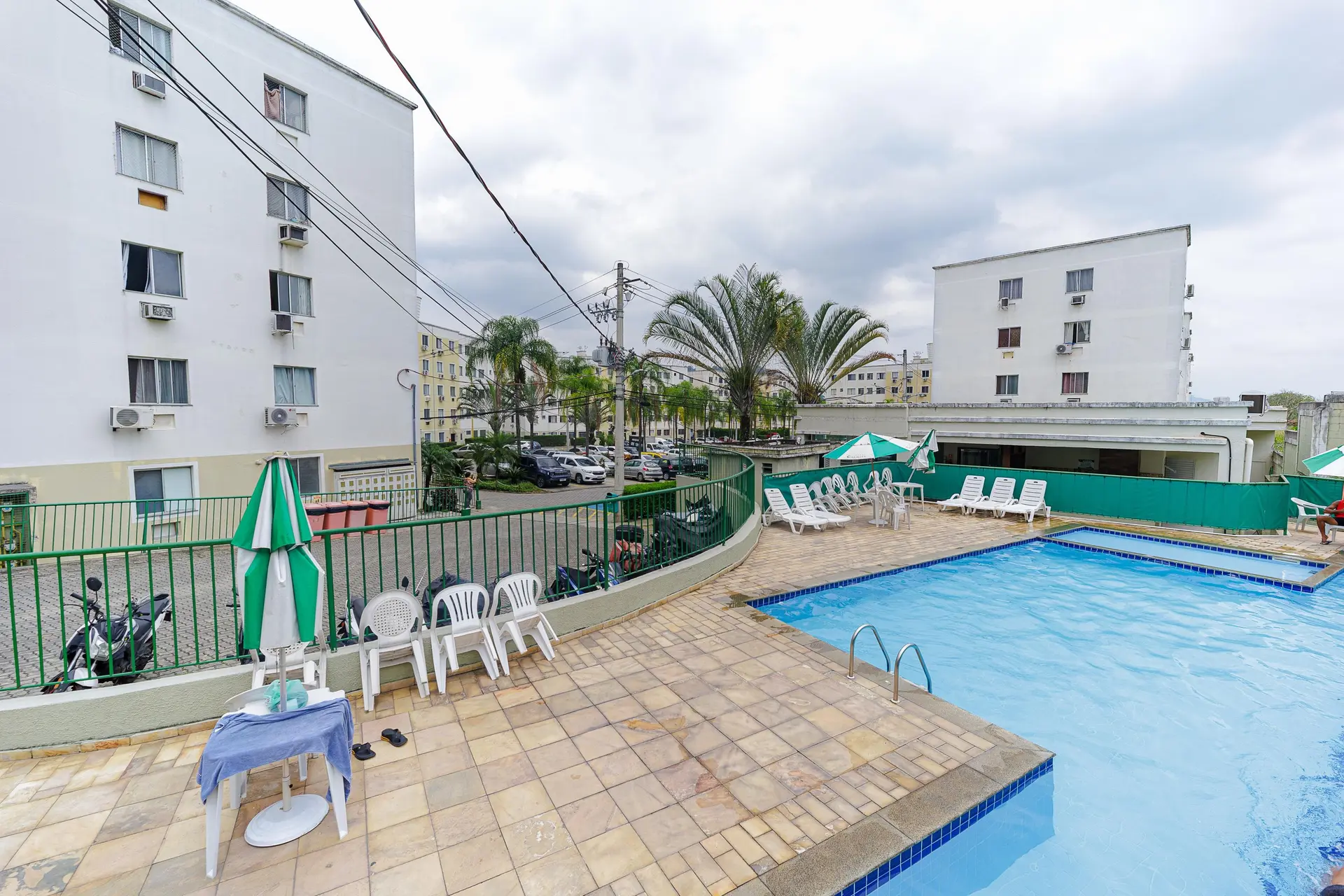 2-bedroom apartment in a building with a pool — photo 22