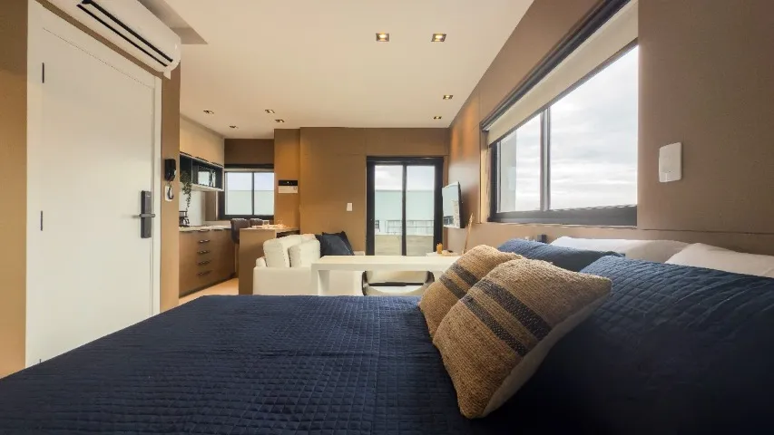 Furnished studio with open-plan kitchen and balcony — photo 5