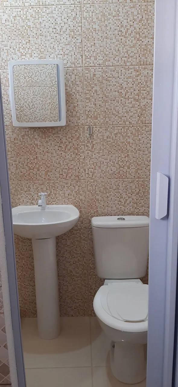 Studio-sized kitinete with 1 bedroom and compact kitchenette — photo 4