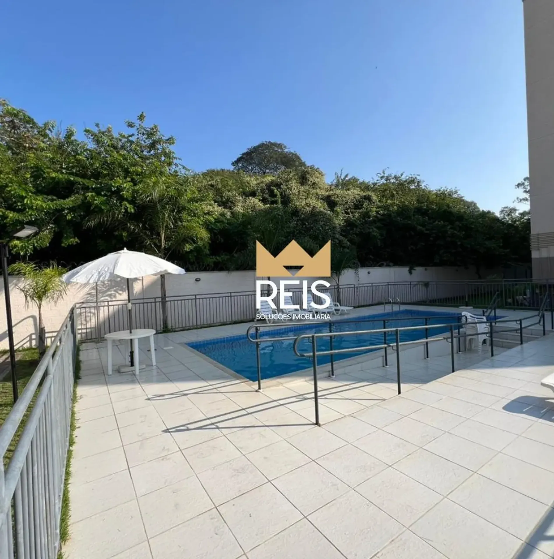 2-bedroom apartment in a building with a pool — photo 7