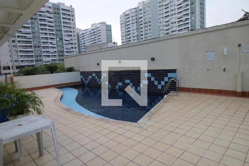 2-bedroom apartment in a building with a pool — photo 14