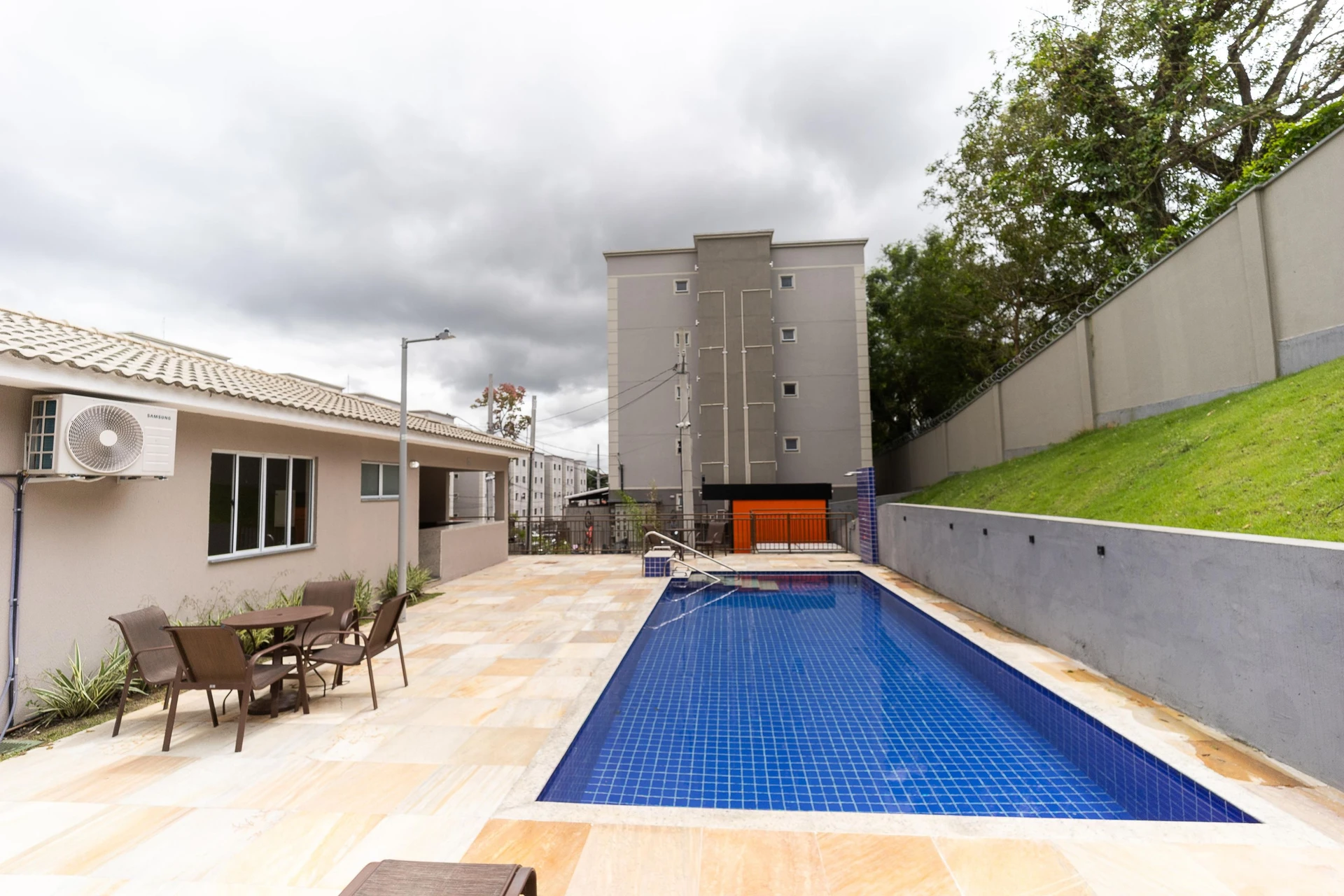 2-bedroom apartment in a building with a pool — photo 14