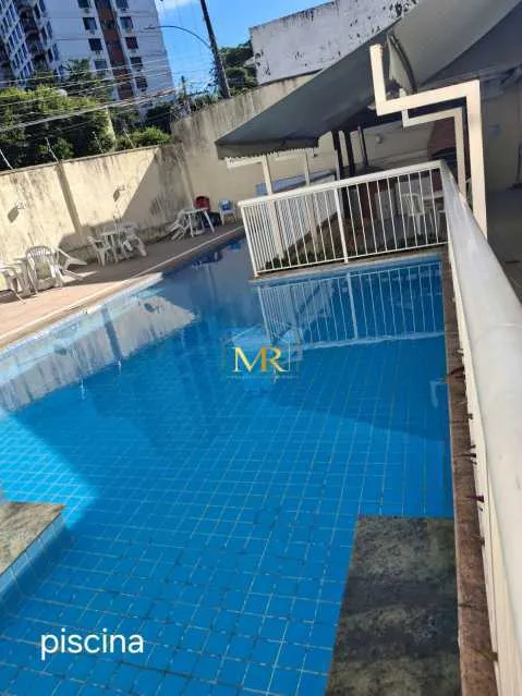 2-bedroom apartment in a building with a pool — photo 11