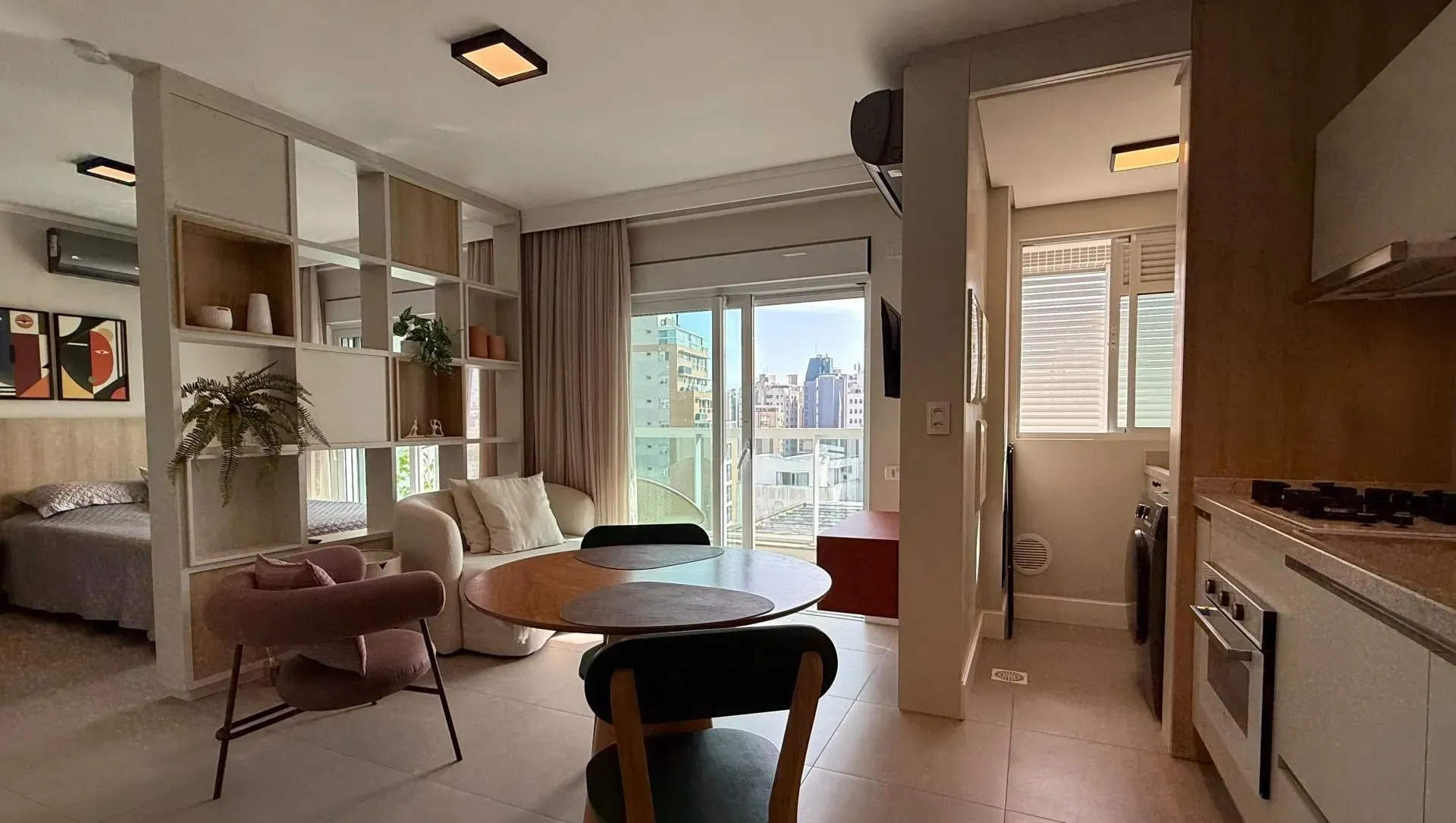 Furnished studio with open-plan kitchen and balcony