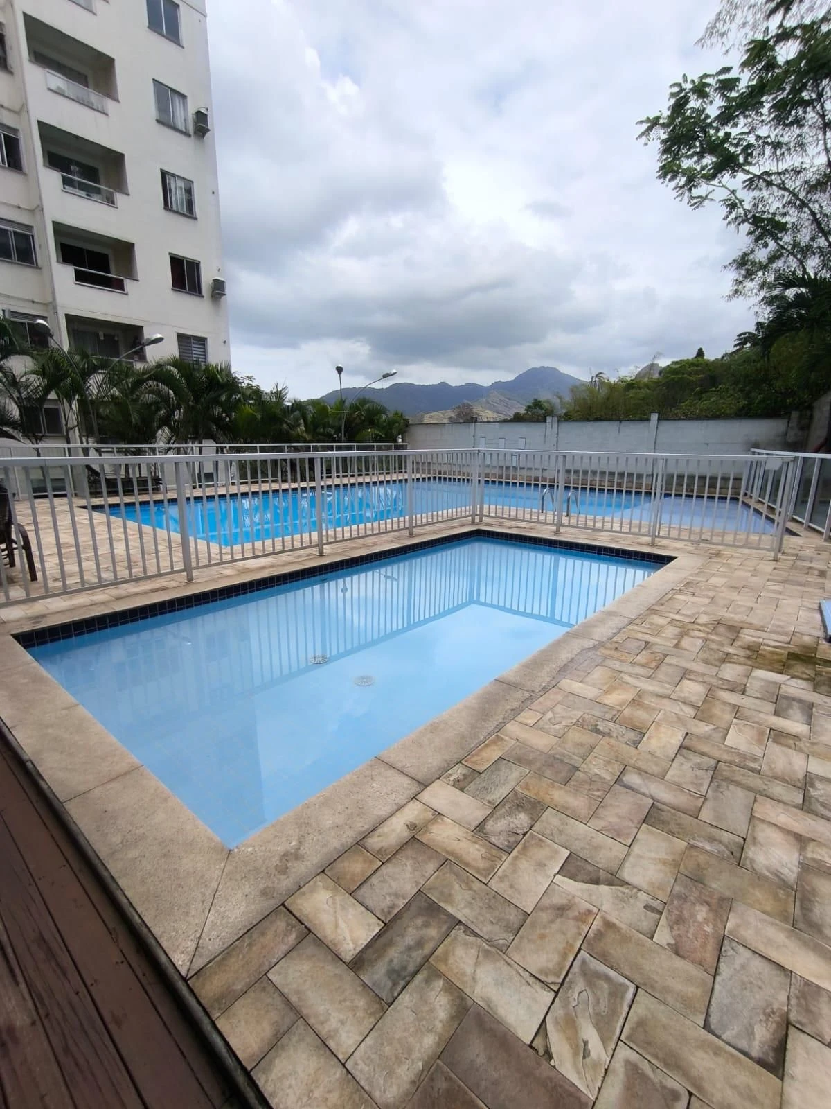 2-bedroom apartment in a building with a pool — photo 39