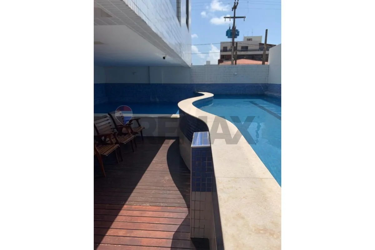 2-bedroom apartment in a building with a pool — photo 18