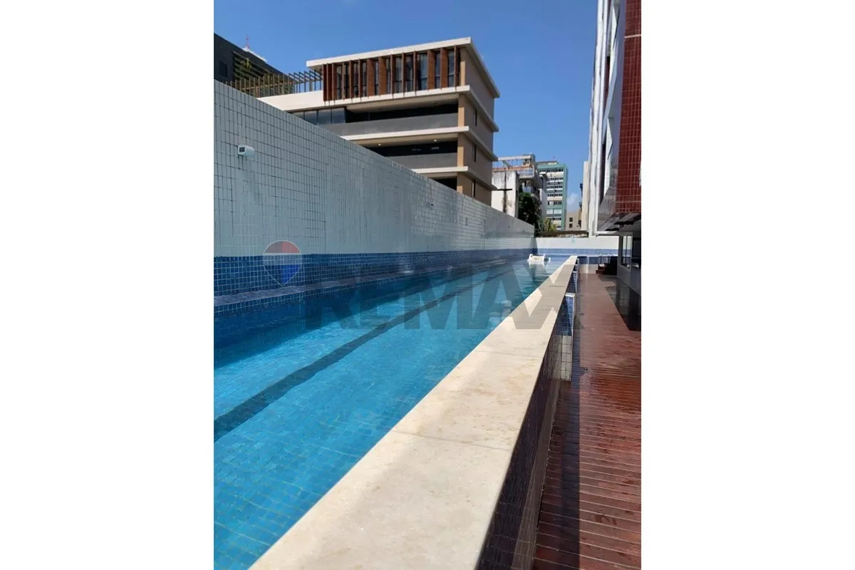 2-bedroom apartment in a building with a pool — photo 13