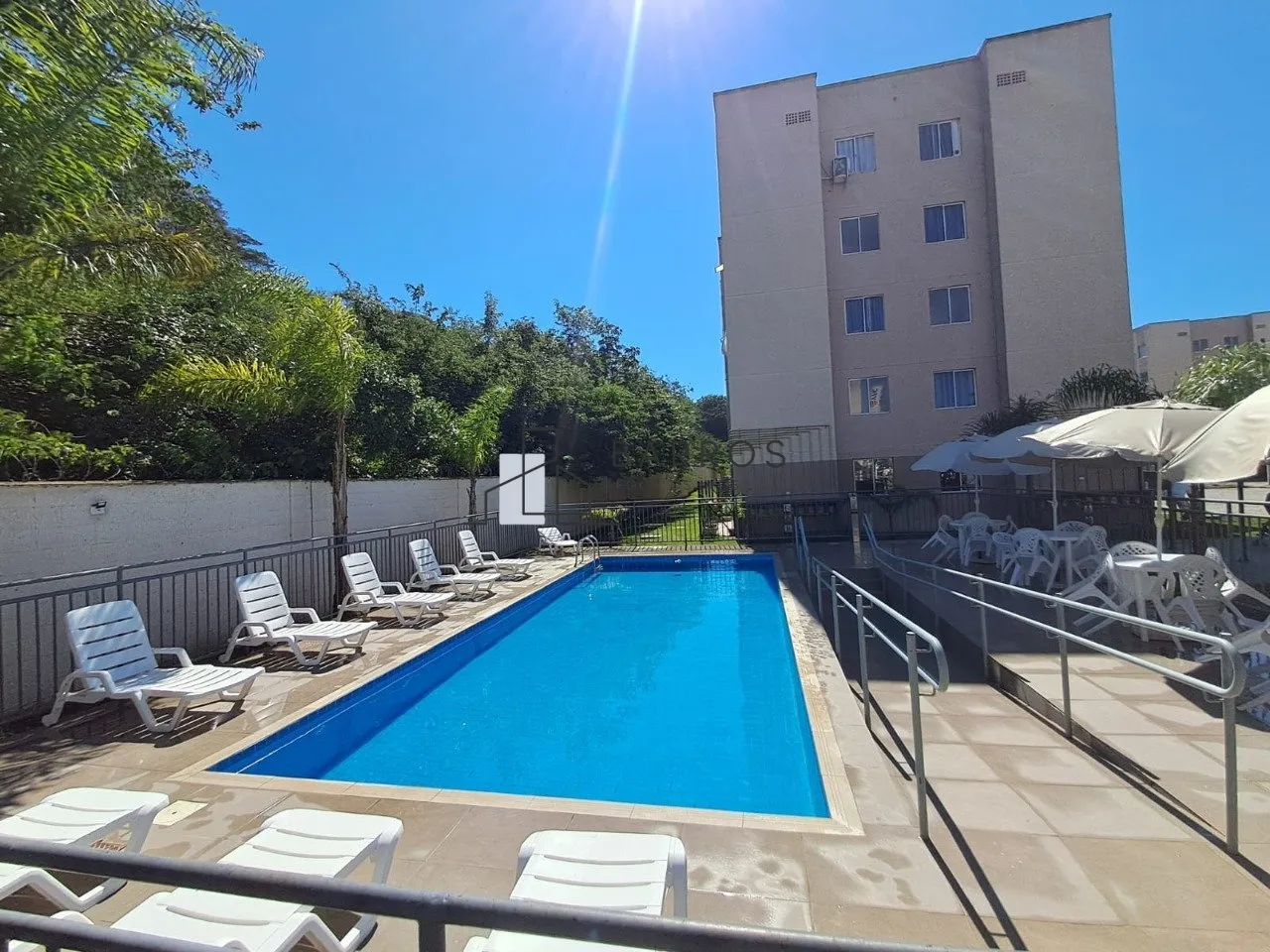 2-bedroom apartment in a building with a pool