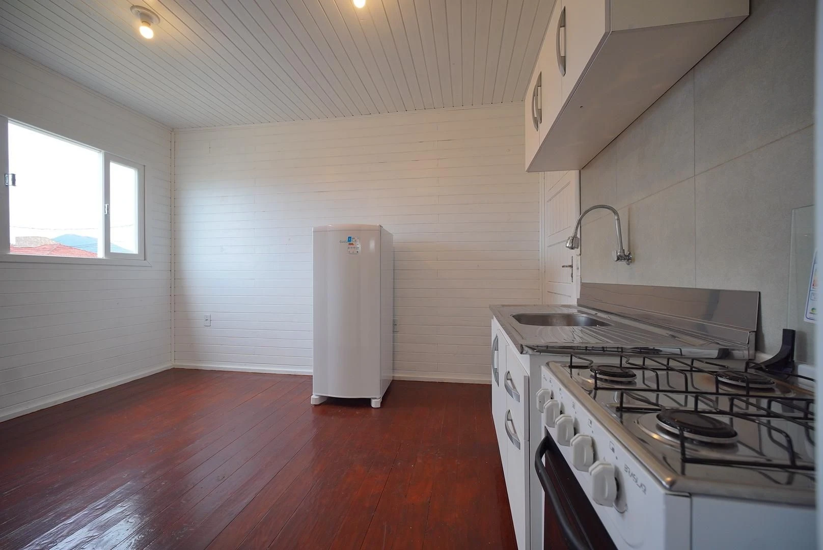 Wood or laminate floors in a one-bedroom house, 24 m² — photo 5