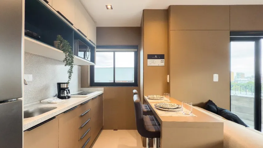 Furnished studio with open-plan kitchen and balcony — photo 12